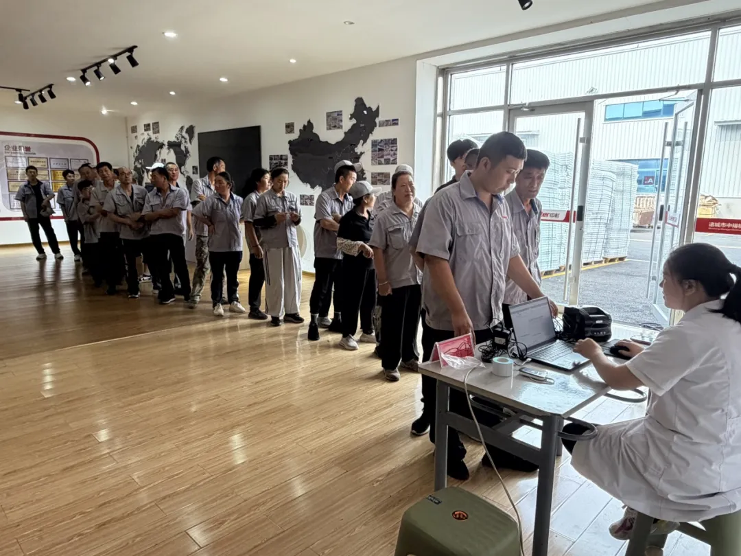 Kaleter employees lining up for an on-site health checkup at the factory