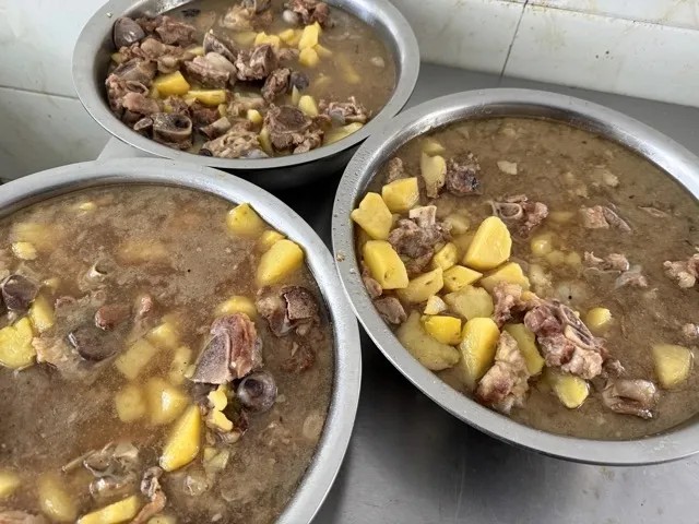 Bowls of braised chicken and potato stew prepared for Kaleter's June birthday celebration
