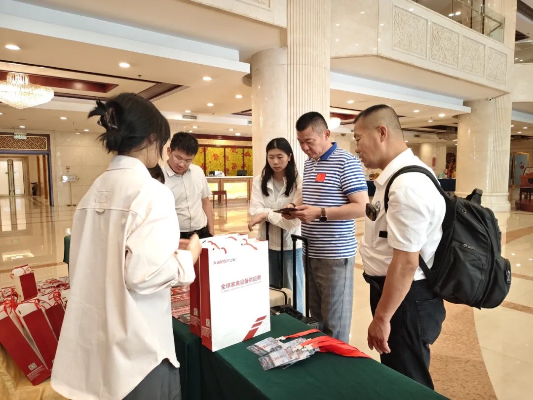 Attendees checking in at the Kaleter table ahead of the forum